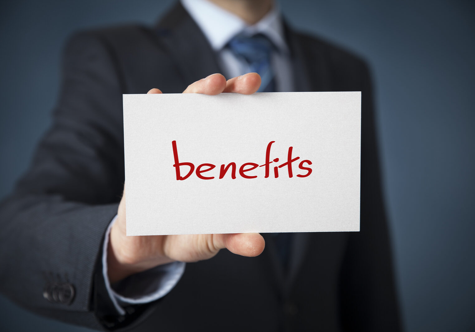 Businessman show on card text benefits. Benefits concept.